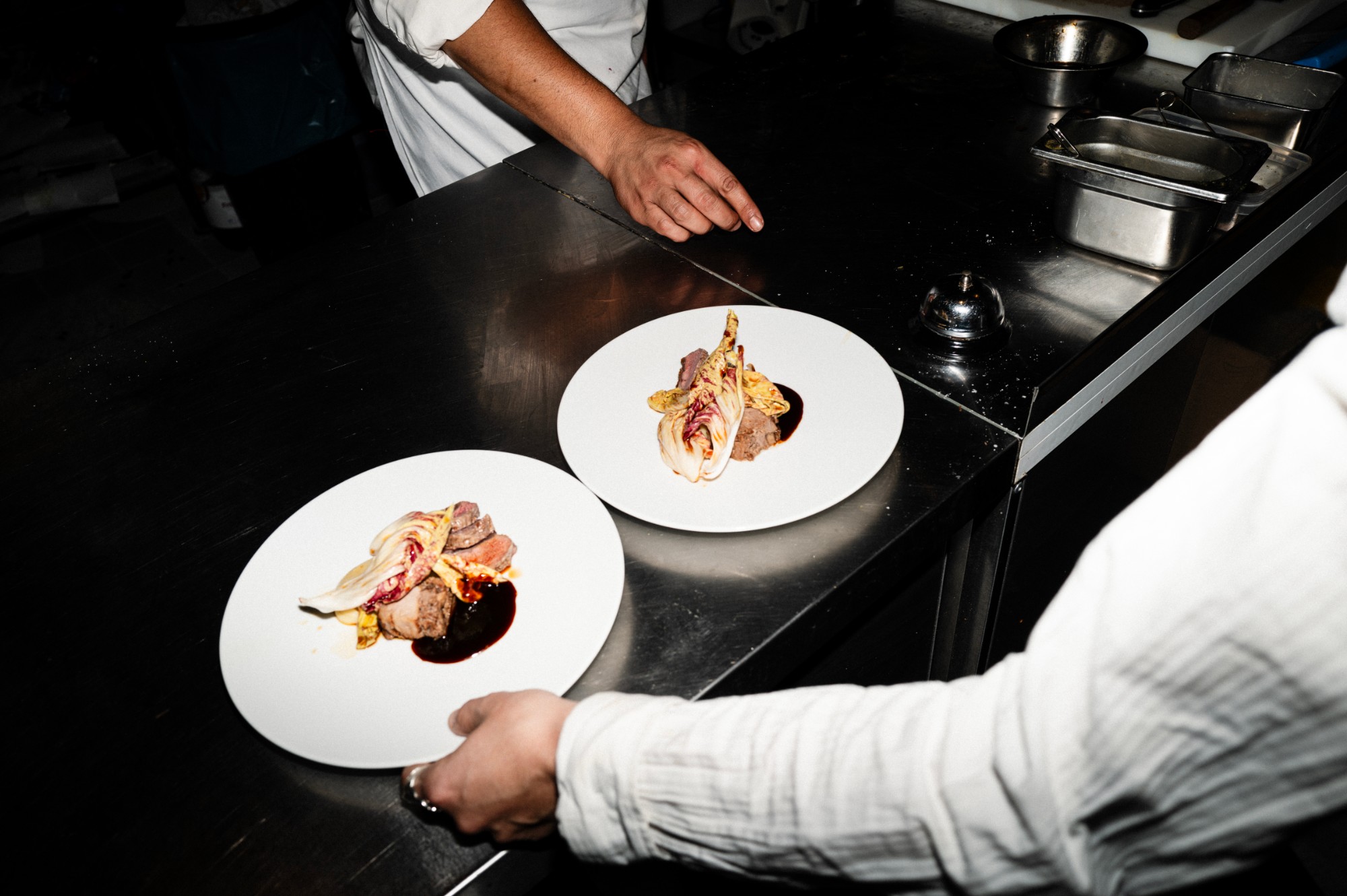 Two plated main courses on the pass