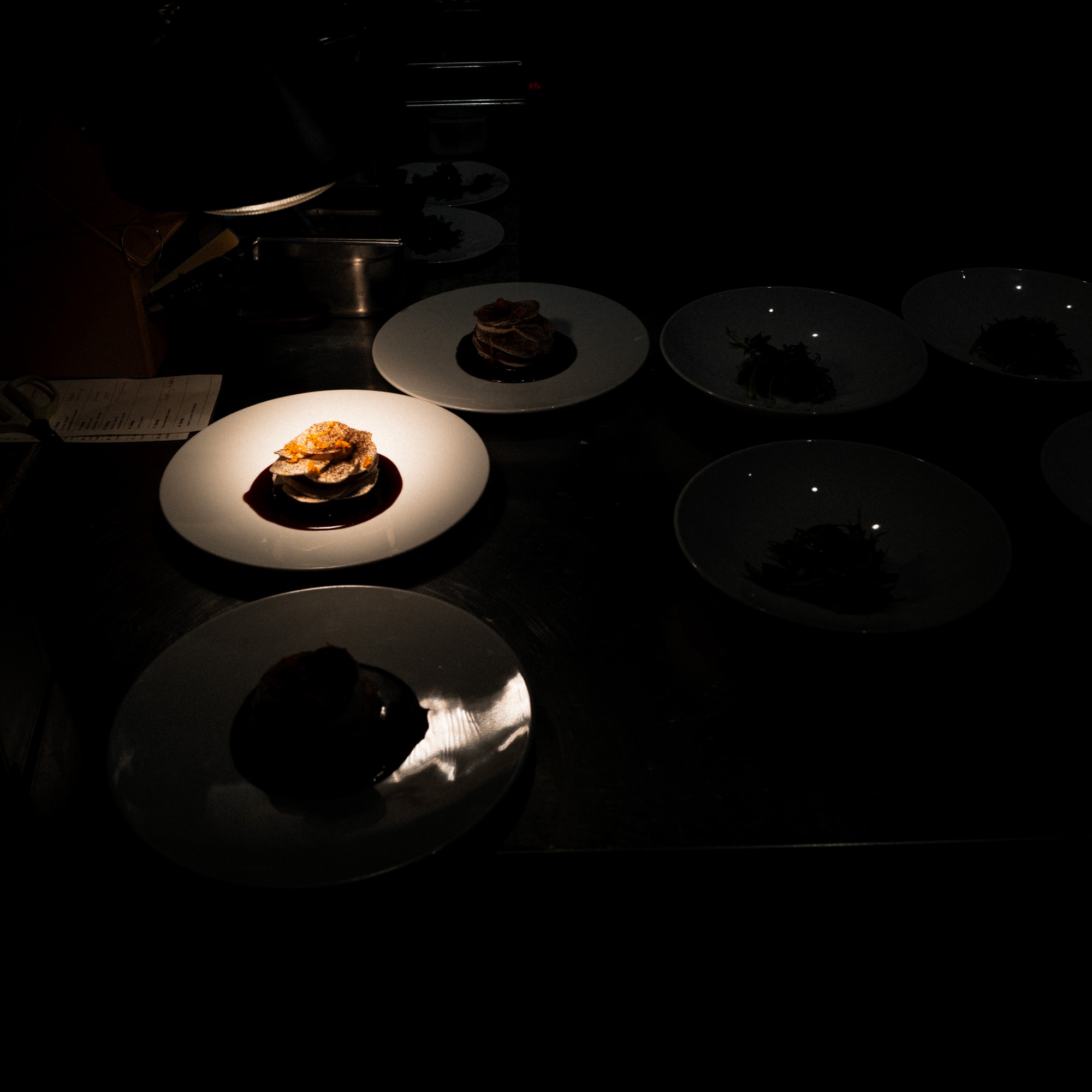 Plated dishes under low light