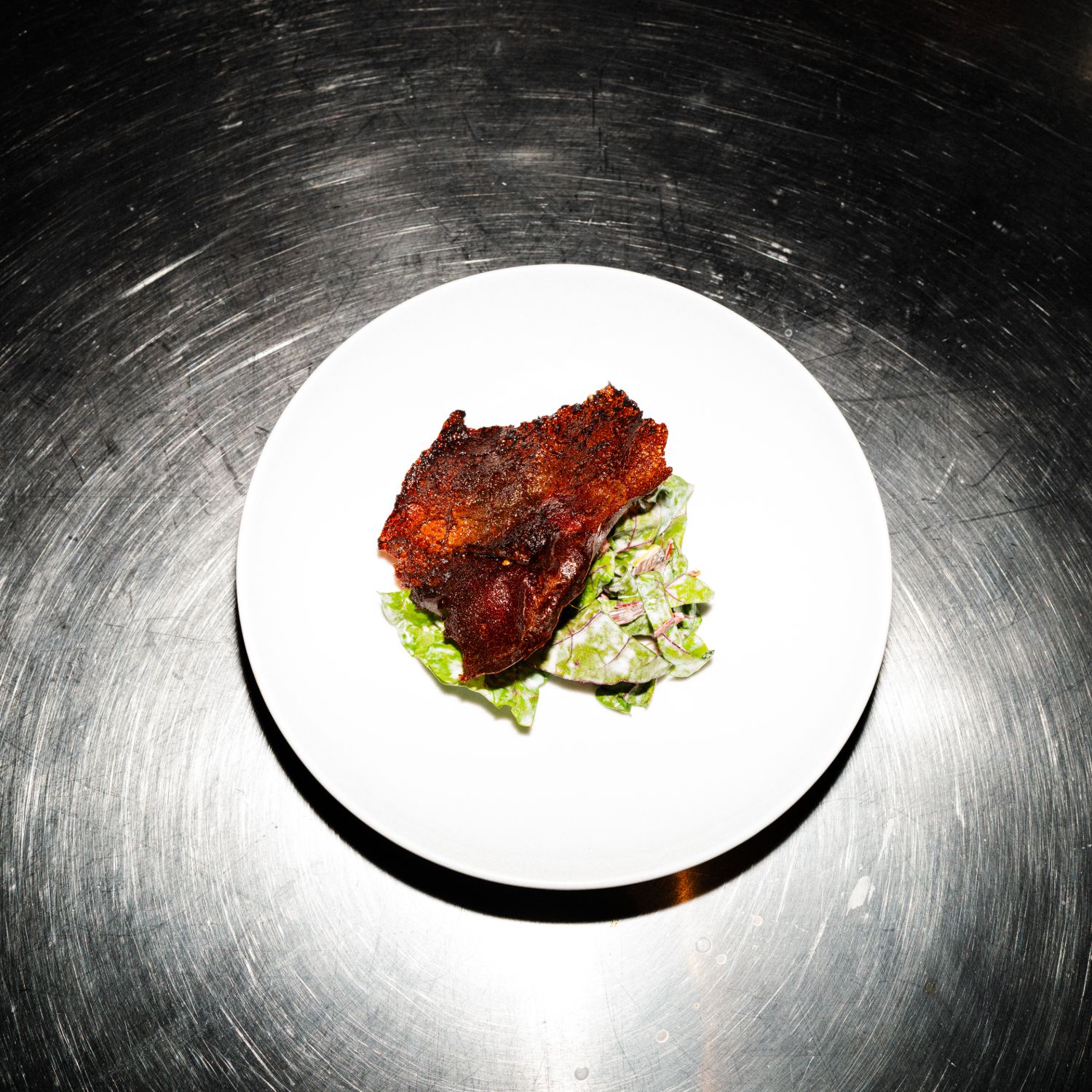 Crisp course over dressed leaves